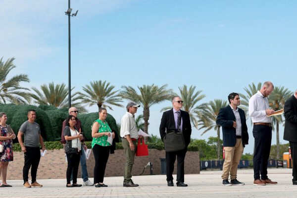 Job seekers wait in line to enter the Mega JobNewsUSA South Florida Job Fair held in the Amerant Bank Arena on April 30, 2026 in Sunrise, Florida.