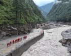Overflowing lake halts rescue efforts as Nepal-Tibet flood death toll hits 474