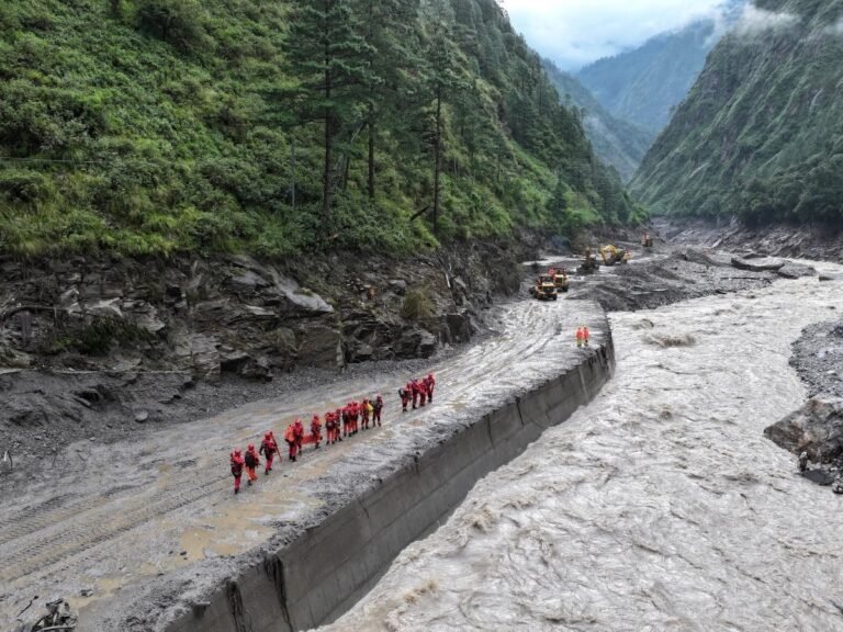 Lake overflows on Nepal-China border, sparking panic and halting rescue