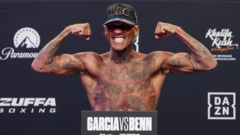 Benn defies concerns to make weight for Garcia bout