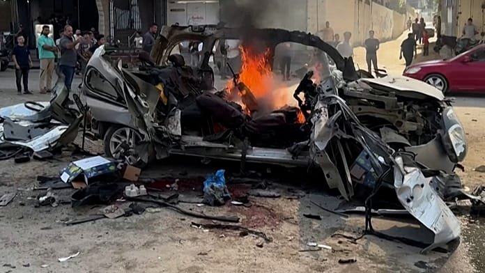 Israeli strike on Gaza vehicle kills two Hamas engineers, 13 wounded