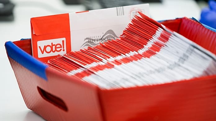 Trump presses Supreme Court to curb mail voting as ballots begin reaching Americans
