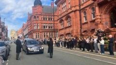 Fans pay their respects at Sir Billy Boston's funeral