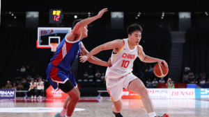 China routs defending champion Philippines to finish top in Group C