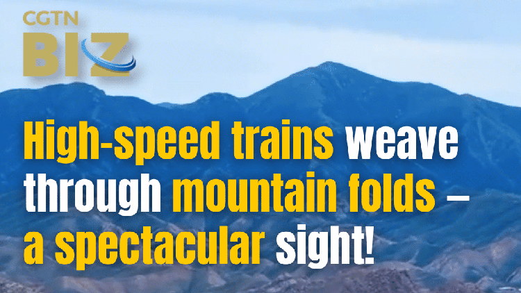 High-speed trains weave through mountain folds — a spectacular sight!