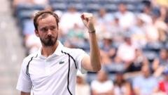 Birds stop play but Medvedev flies into third round